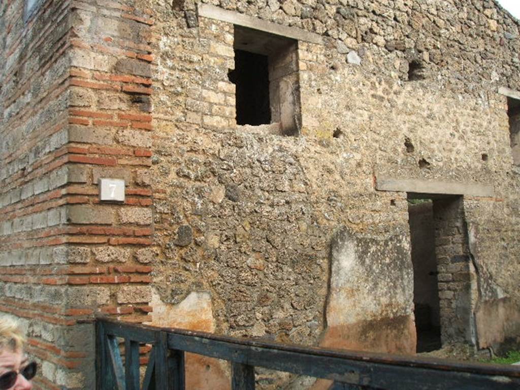 II.4.7 Pompeii. December 2006. East wall and doorway into triclinium.