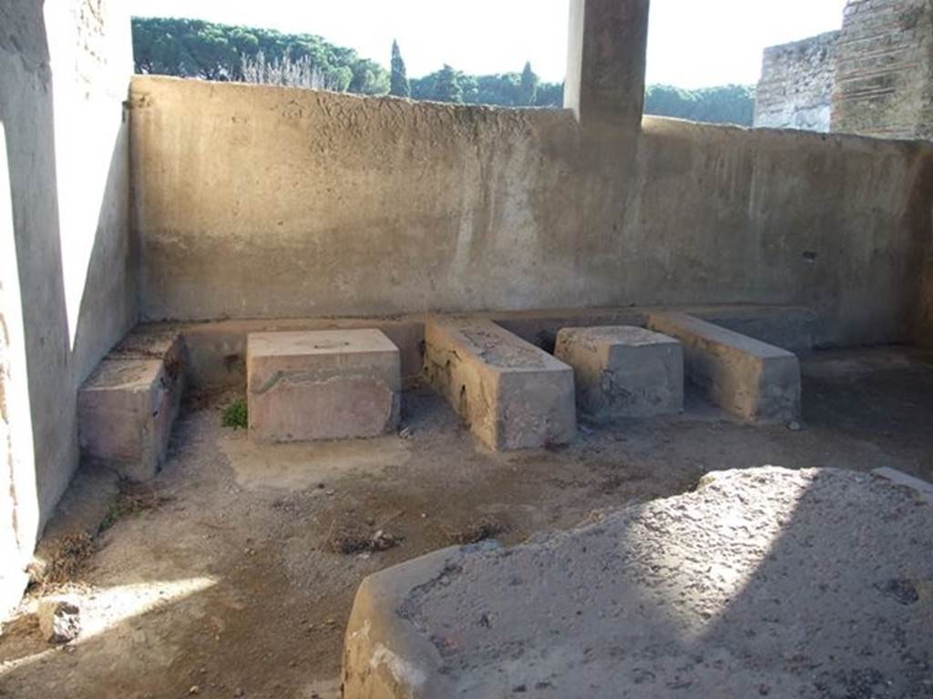 II.4.7 Pompeii. December 2006. Stone seats and tables in compartments.
