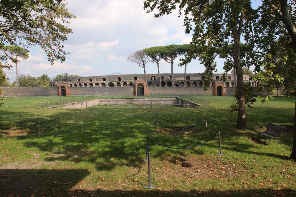 II.7.3 Pompeii. June 2019. Looking east across pool in Palestra, with entrance at II.7.4, left of centre, and II.7.3, right of centre.
Photo courtesy of Buzz Ferebee.

