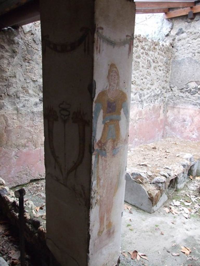 II.9.1. December 2007.  Painting of Horn of Plenty and Priapus on column on the north side of the triclinium.