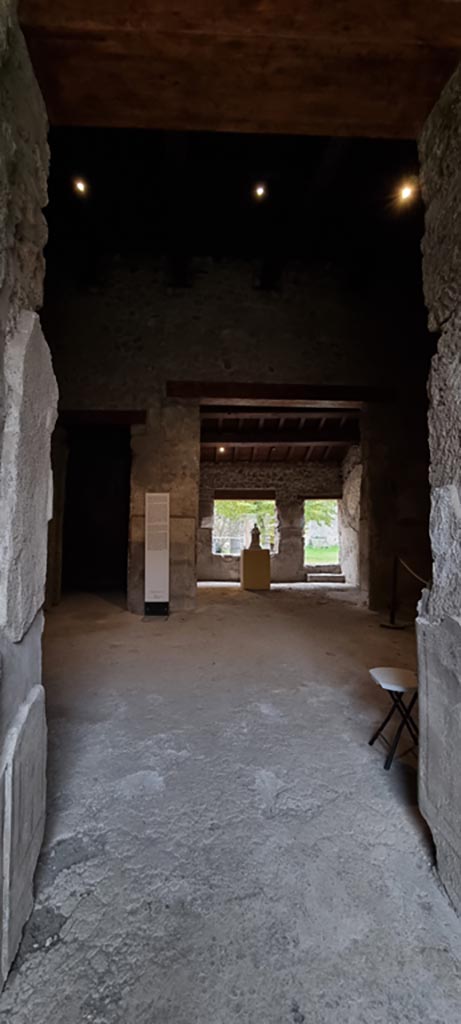 II.9.4 Pompeii. December 2023.
Looking east from entrance corridor across atrium 2, towards rear room 5. 
Photo courtesy of Miriam Colomer.
