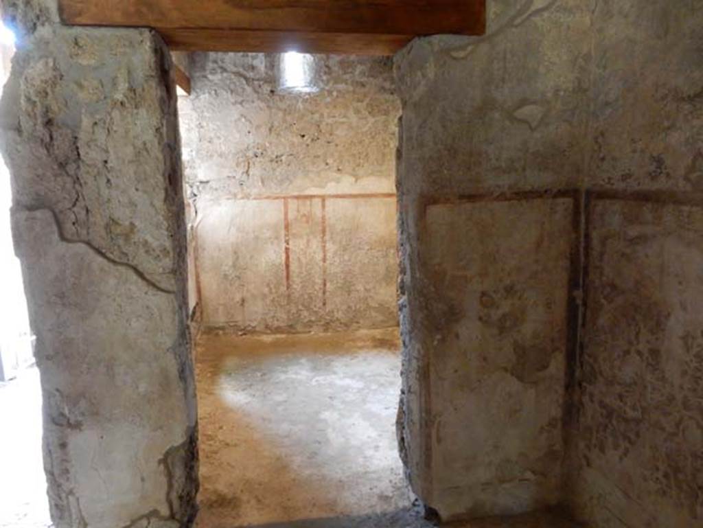 II.9.4, Pompeii. May 2018. Room 1. Looking through doorway to room to north (left) of entrance.
Photo courtesy of Buzz Ferebee. 
