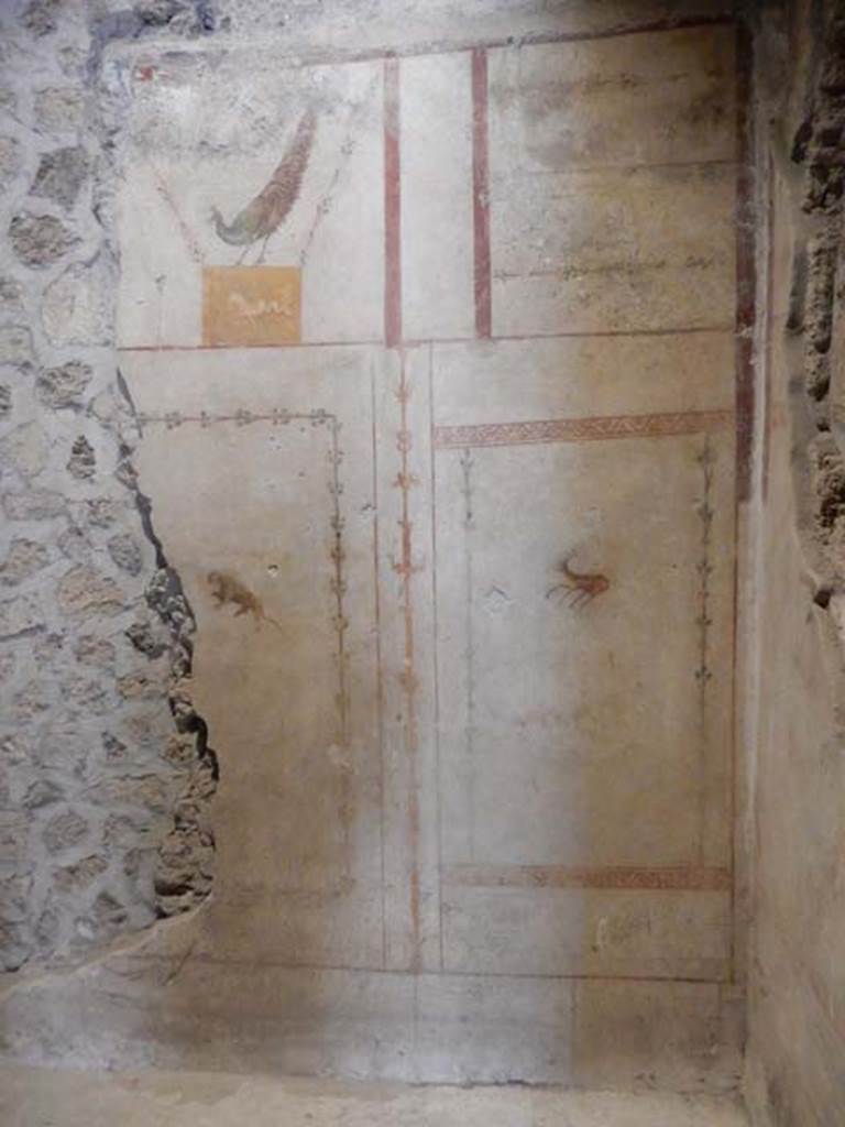 II.9.4, Pompeii. May 2018. Room 4, east wall at south end with painted decoration. 
Photo courtesy of Buzz Ferebee. 
