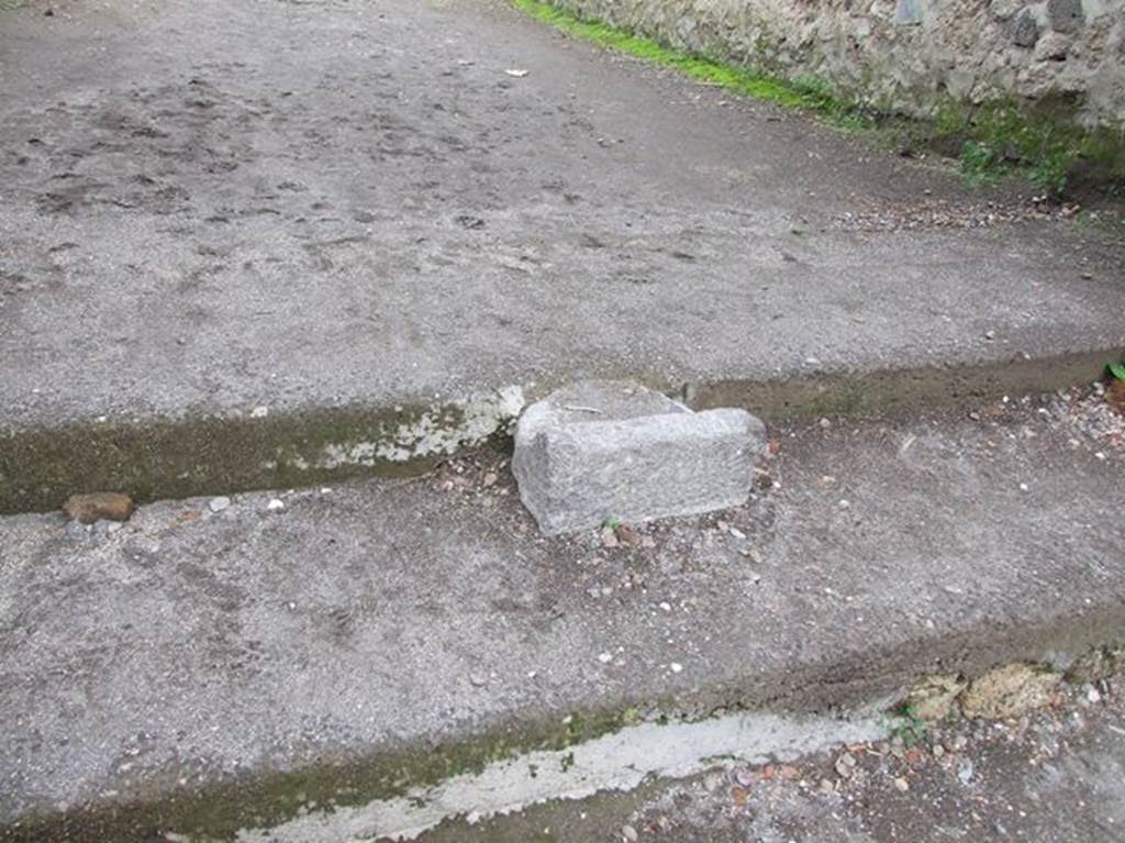 Base of portal between II.1.9 and II.9.6, in centre of steps to Via di Castricio from Via di Nocera. It was originally used for crowd control to the Amphitheatre.   
