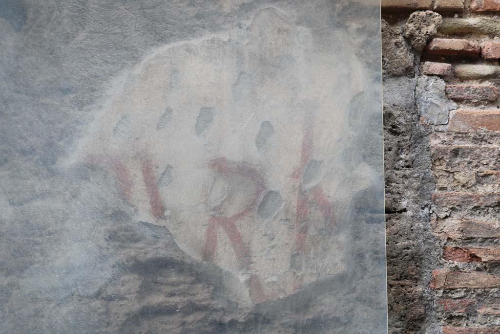 III.1.1 Pompeii. December 2018. Remains of painted graffiti on pilaster between III.1.1 and III.1.2. Photo courtesy of Aude Durand.