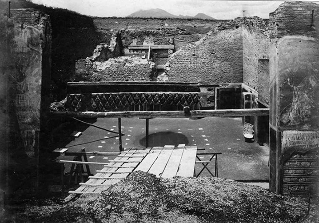 III.3.6 Pompeii. Old postcard, c. 1916? During excavation? 
Looking into Schola Armaturarum with cast of shutters in centre.
