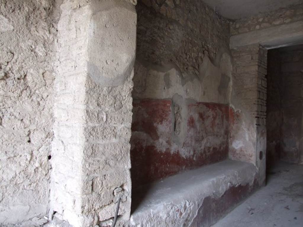 III.4.3 Pompeii. May 2017. Room 1, detail of remains of painted decoration on west wall above bench. Photo courtesy of Buzz Ferebee.
