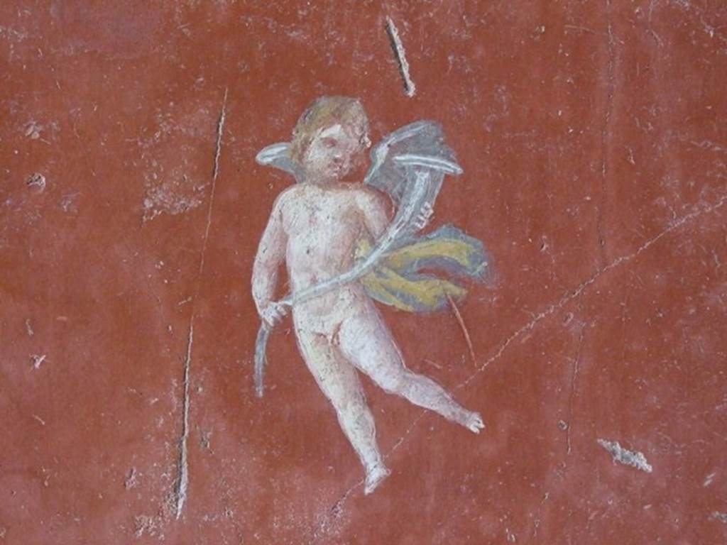 III.4.b Pompeii. March 2009. Room 4, west wall of exedra with painting of cupid with horn.