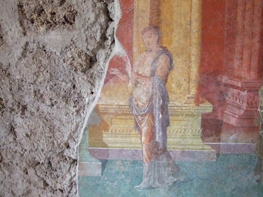 III.4.b. Pompeii.  March 2009. Room 3.  Oecus.  West wall.  Detail of wall painting of figure.