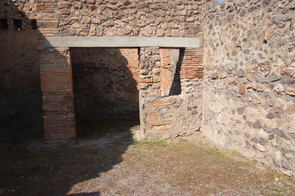 V.1.2 Pompeii. October 2023. Doorway to room with window in north-east corner. Photo courtesy of Klaus Heese.