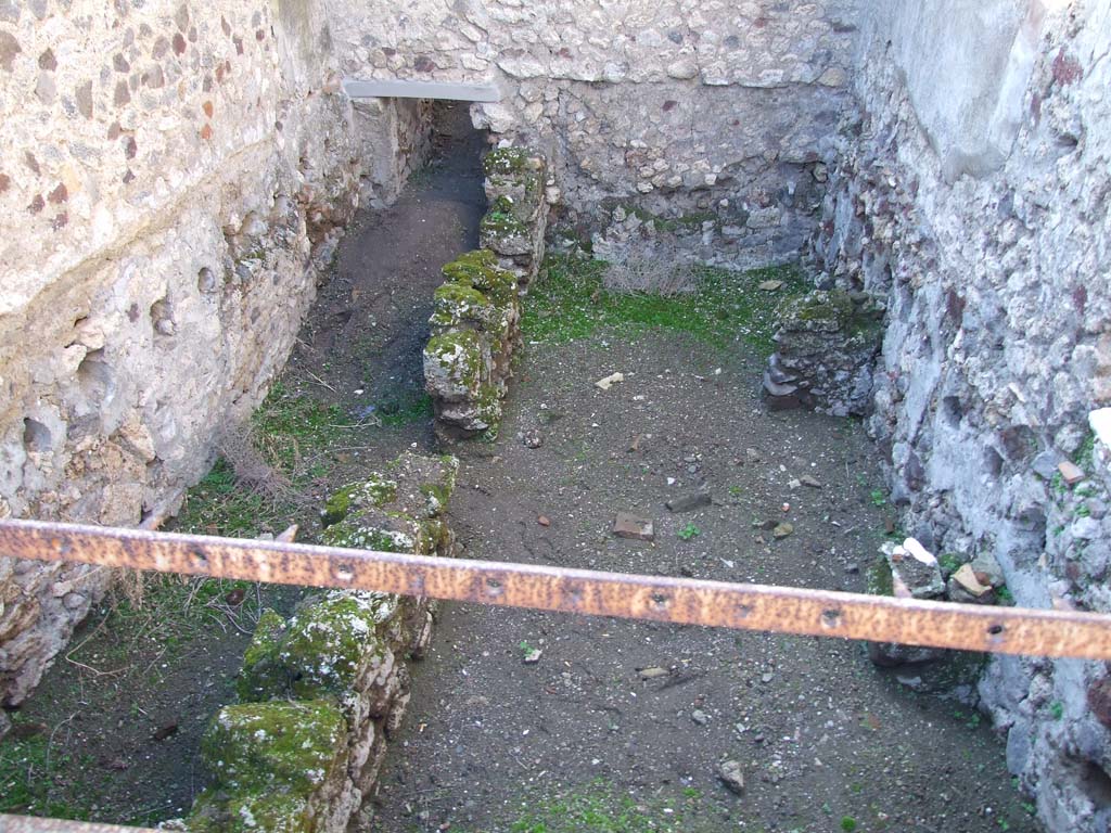 V.1.7 Pompeii. December 2007. Room 19. Cellar/lower room on west side of peristyle, reached by small ramp at rear. Cellar under triclinium.