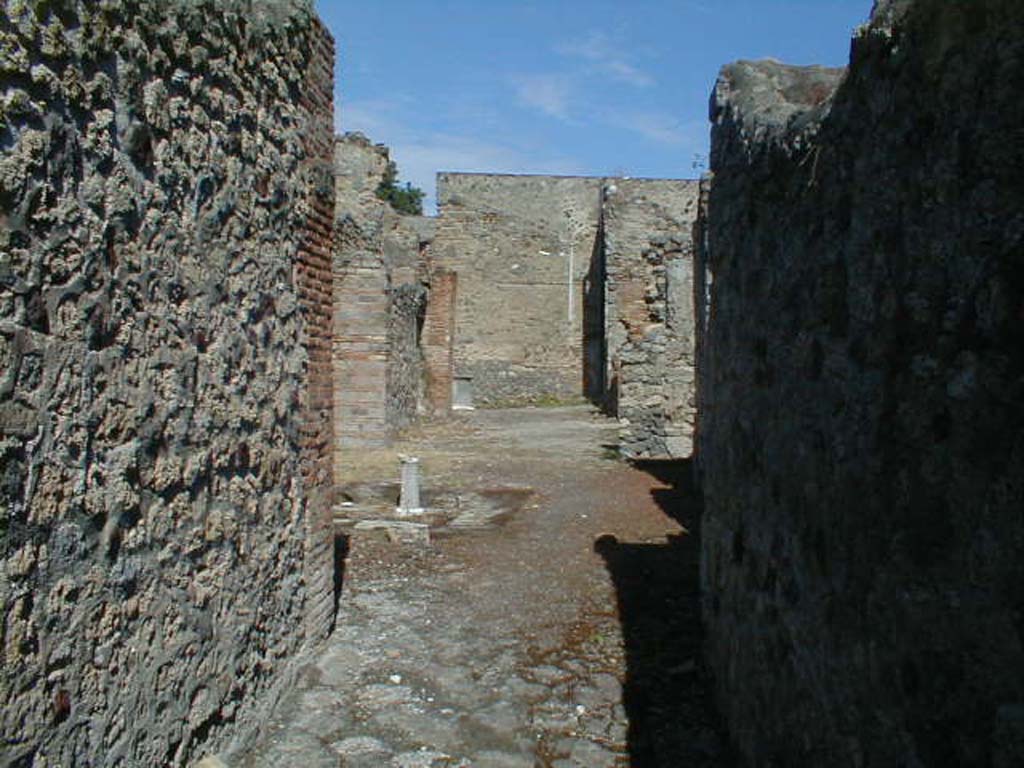V.1.23 Pompeii. March 2009. Doorways to rooms 2, 3 and 4 on south side of atrium. 