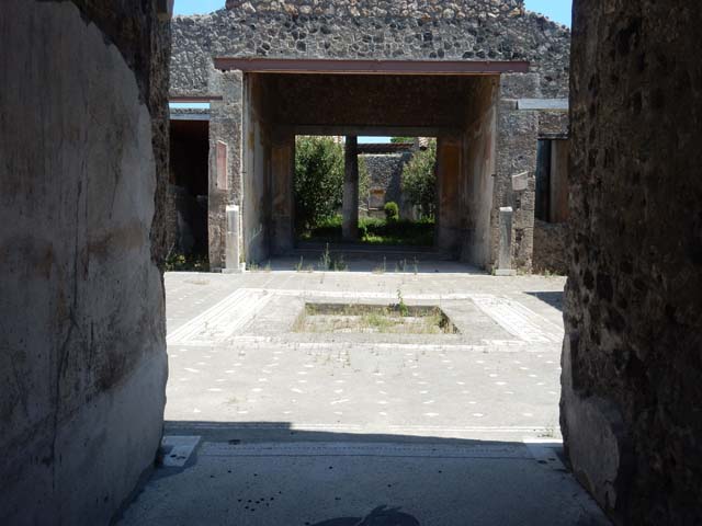 V.1.26 Pompeii. July 2011. Room 1. Looking east from entrance, through fauces to atrium. Photo courtesy of Rick Bauer.