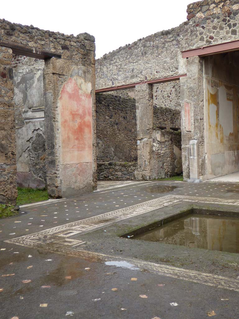 V.1.26 Pompeii. January 2017. 
Room “b”, looking north-east across impluvium in atrium towards the east wall of room “e”, the north ala.
Foto Annette Haug, ERC Grant 681269 DÉCOR.
