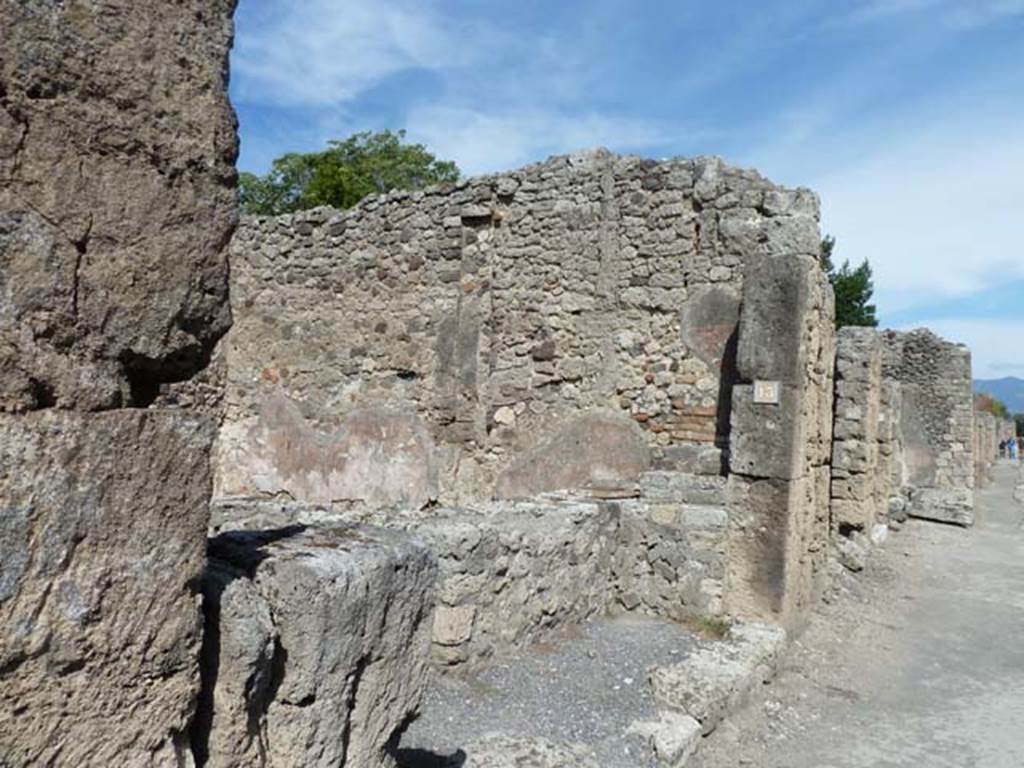 V.2.13 Pompeii. September 2015. Looking east towards entrance doorway on north side of Via di Nola.