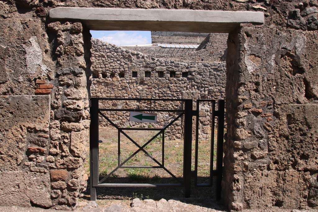 V.2.f, Pompeii. September 2021. Looking east through entrance doorway. Photo courtesy of Klaus Heese.
