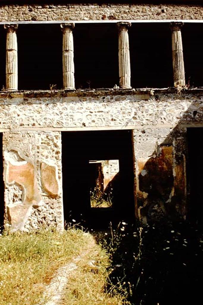 V.2.h Pompeii. 1959. South side of atrium, with doorway to tablinum ‘f’. 
At the rear of the tablinum (f), a decorated wall in room (h) can be seen. Photo by Stanley A. Jashemski.
Source: The Wilhelmina and Stanley A. Jashemski archive in the University of Maryland Library, Special Collections (See collection page) and made available under the Creative Commons Attribution-Non Commercial License v.4. See Licence and use details.
J59f0445

