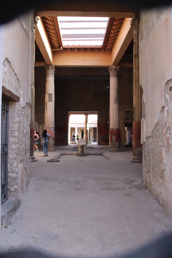 V.2.i Pompeii. March 2023. 
Room 1, atrium and impluvium looking south towards tablinum and peristyle. Photo courtesy of Johannes Eber.
