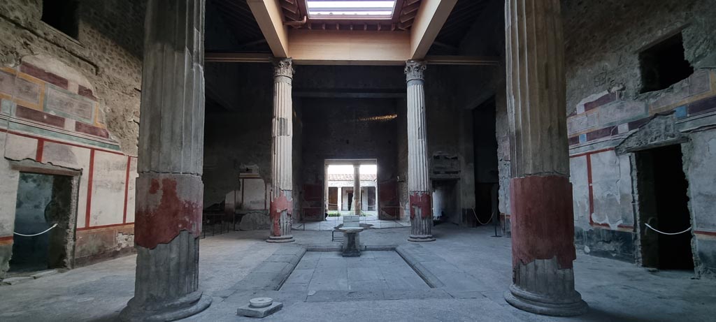 V.2.i Pompeii. March 2023. 
Room 1, looking north-west across atrium towards entrance corridor and small doorway to room 2. Photo courtesy of Johannes Eber.
