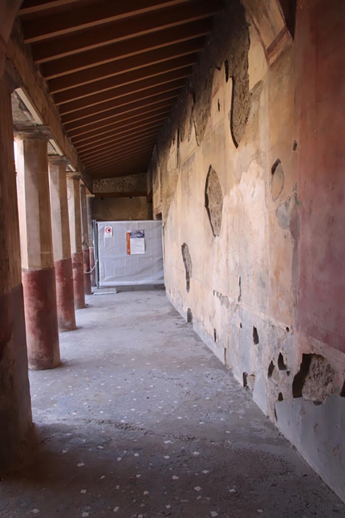 V.2.i Pompeii.  October 2023. 
Looking along west wall of west portico from south end of Corridor 10. Photo courtesy of Klaus Heese.
