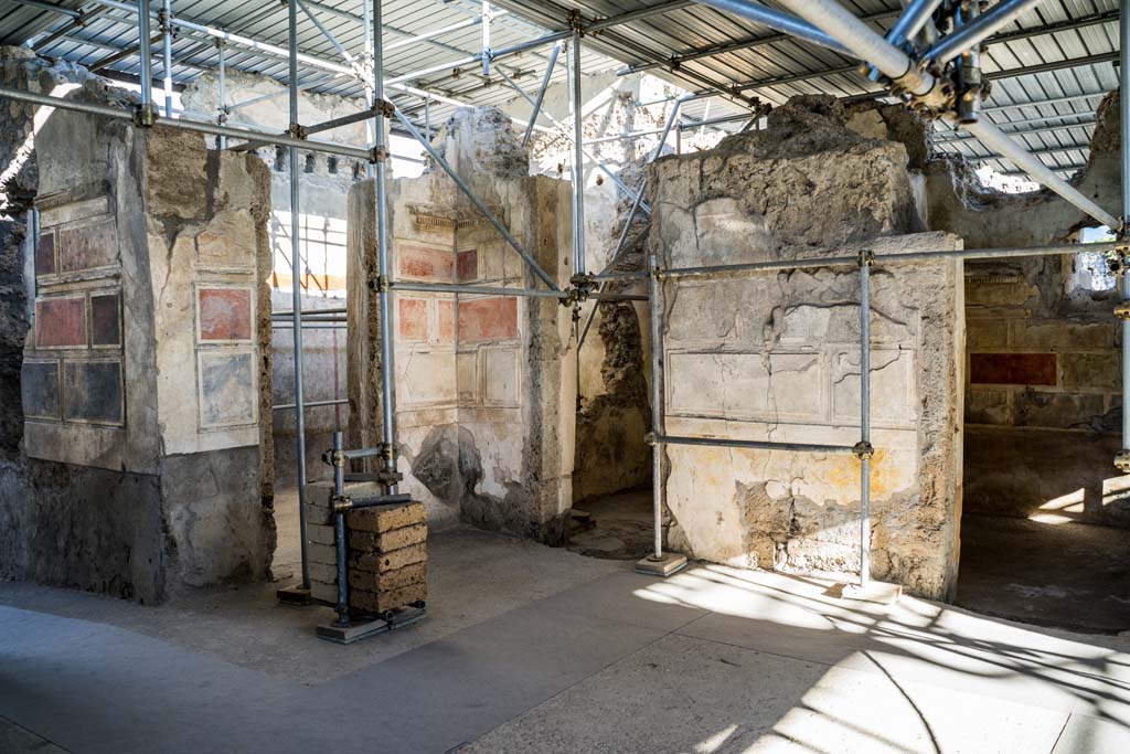 V.2.Pompeii. Casa di Orione. May 2018. Room A17 on the south side during excavation.
Photograph © Parco Archeologico di Pompei.
This room was the kitchen, a “service room” recognised by its simple decoration and the presence on the floor 
of various artefacts from table and pantry (cooking pots and tablewares) and amphorae, as well as from the finding near to the east wall of a square structure that defined a masonry hearth.  There at the time of excavation, the ash of the last baking/cooking was still preserved, covered by the upper portion of an amphora which was to serve as a lid. Presumably, the last cooked meal, and perhaps never eaten, by the owner of the house.
See Osanna M, 2019. Pompei. Il tempo ritrovato. Le Nuove Scoperte. Milano: Rizzoli, (p.99).


