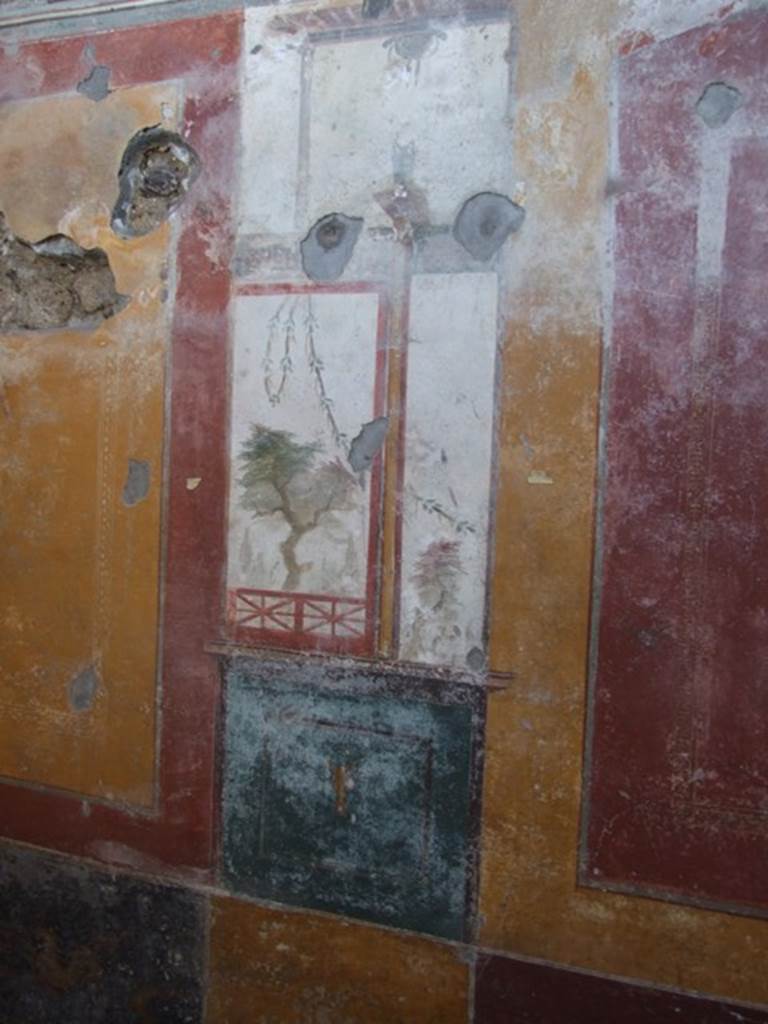 V.3.6 Pompeii. March 2009. Triclinium.  West wall, detail of painted panel, with Tree and Garland.