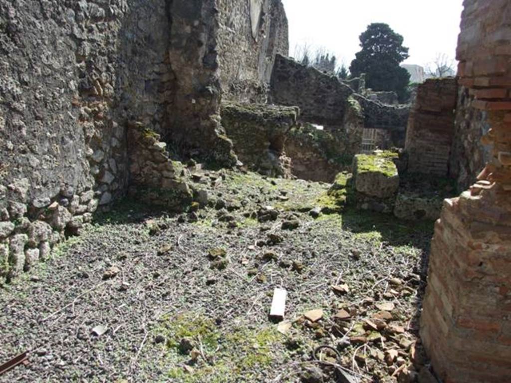 V.4.9 Pompeii. March 2009.  Looking south from entrance into the room in the south-east corner of the atrium, across site of latrine. In the top-right-rear of the photo can be seen the rear rooms of V.4.7.

