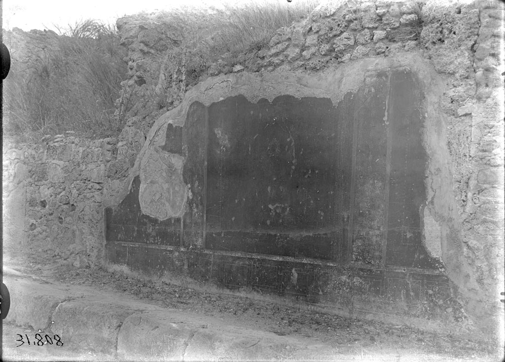 V.6.12 Pompeii. December 2005. V.6.12 entrance is centre right with the wide horizontal rectangular stone. 

