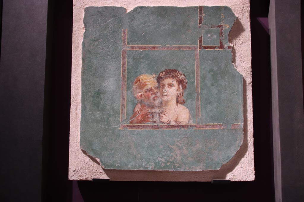 VI.2.22 Pompeii. October 2022. 
Wall painting of the Maenad embracing an old Silenus and offering him a silver drinking cup filled with wine. SAP 17713. 
This was originally part of a larger wall panel.  Photo courtesy of Klaus Heese.
