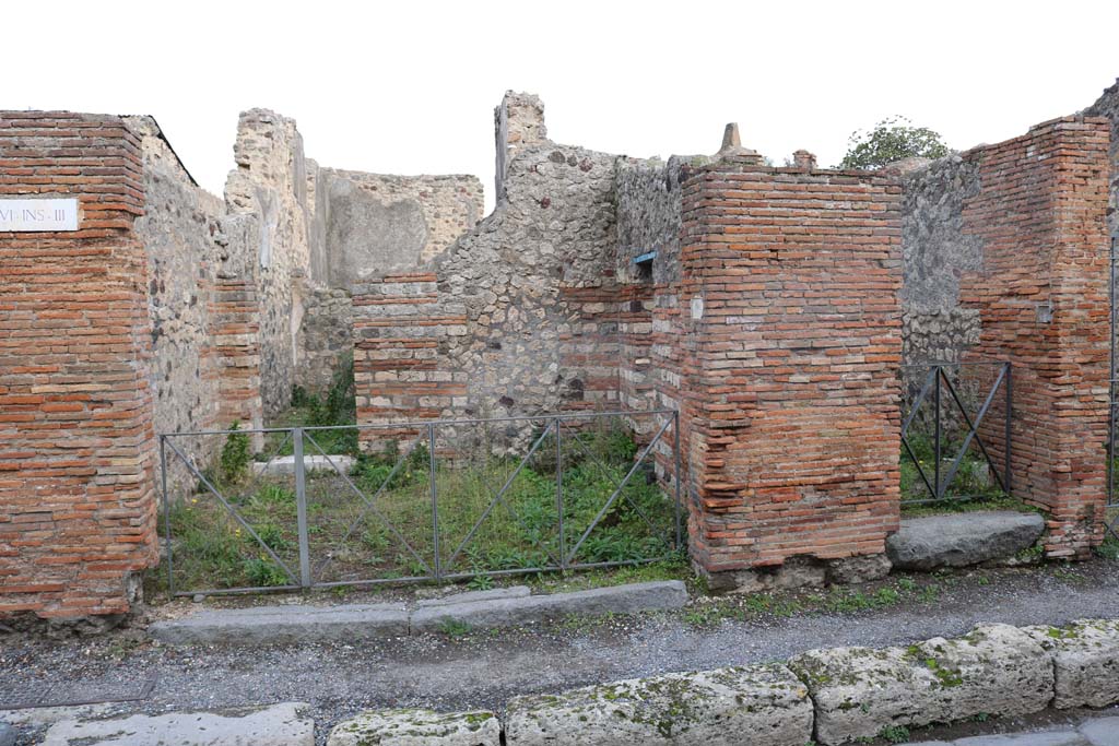 VI.3.1 Pompeii, on left. December 2018. 
Looking east to entrances on Via Consolare, with VI.3.2, on right. Photo courtesy of Aude Durand.
