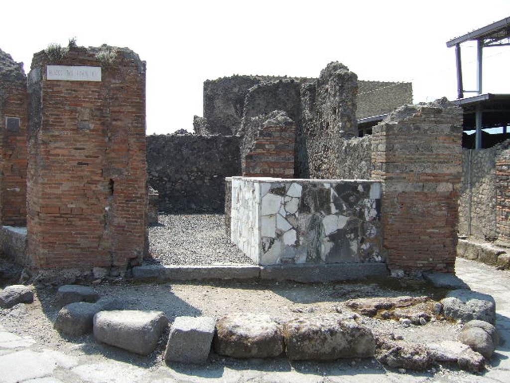 VI.4.1 Pompeii. May 2006. Looking south from junction of Via Consolare with Vicolo del Farmacista (on right).