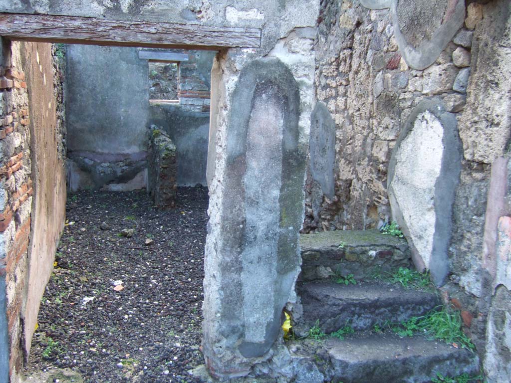 VI.5.16 Pompeii. December 2005. Second room on south side of atrium with latrine and steps to upper floor.
