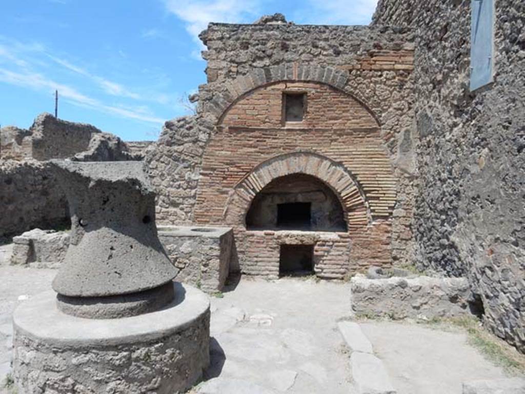 VI.6.17 Pompeii. May 2017. Looking towards oven in bakery.  The bin sunk into the floor was found near the east wall, on the right. Photo courtesy of Buzz Ferebee.

