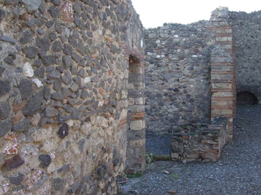 VI.7.15 Pompeii. December 2007. Doorway in south wall of yard, leading into a large room, the triclinium according to Eschebach. At the rear of the doorway can be seen the area with the stairs to the upper floor and window onto yard.
