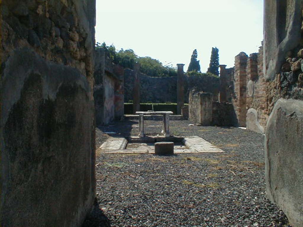 VI.7.19 Pompeii. September 2004. Looking west across atrium from entrance corridor.