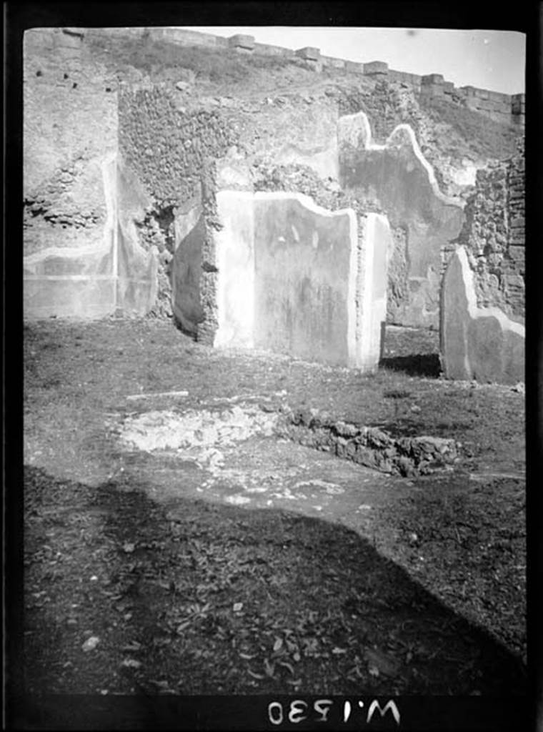 230668 Bestand-D-DAI-ROM-W.1530.jpg
6.9.1 Pompeii.  W1530. North-east corner of atrium, On the left would have been room 12, the oecus with the open doorway into the atrium. The doorway in the east wall of the atrium, on the right, would have led into a large triclinium.
Photo by Tatiana Warscher. With kind permission of DAI Rome, whose copyright it remains. 
See http://arachne.uni-koeln.de/item/marbilderbestand/230668 
According to Warscher, this photo showed the atrium and ala “K”. The atrium had a rectangular shape, it was wider than it was longer, size 8,10m + 4,10m. The impluvium (sized 2,60m + 1.50m) would have been covered with marble, as shown by a piece that one can see in the border (photo number 11). 
See Warscher, T, 1938: Codex Topographicus Pompejanus, Regio VI, insula 9: Pars prima, (no.11), DAIR, Rome.  
