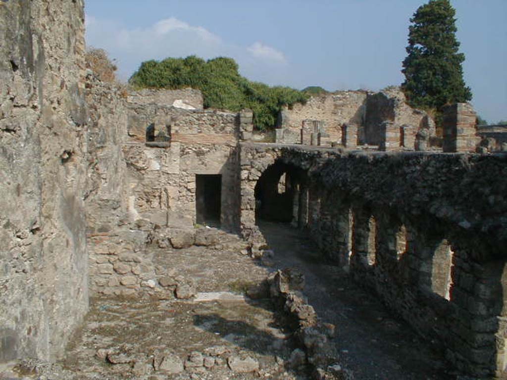 VI.10.7 Pompeii. September 2004. Looking north across rooms on west side of garden.  
