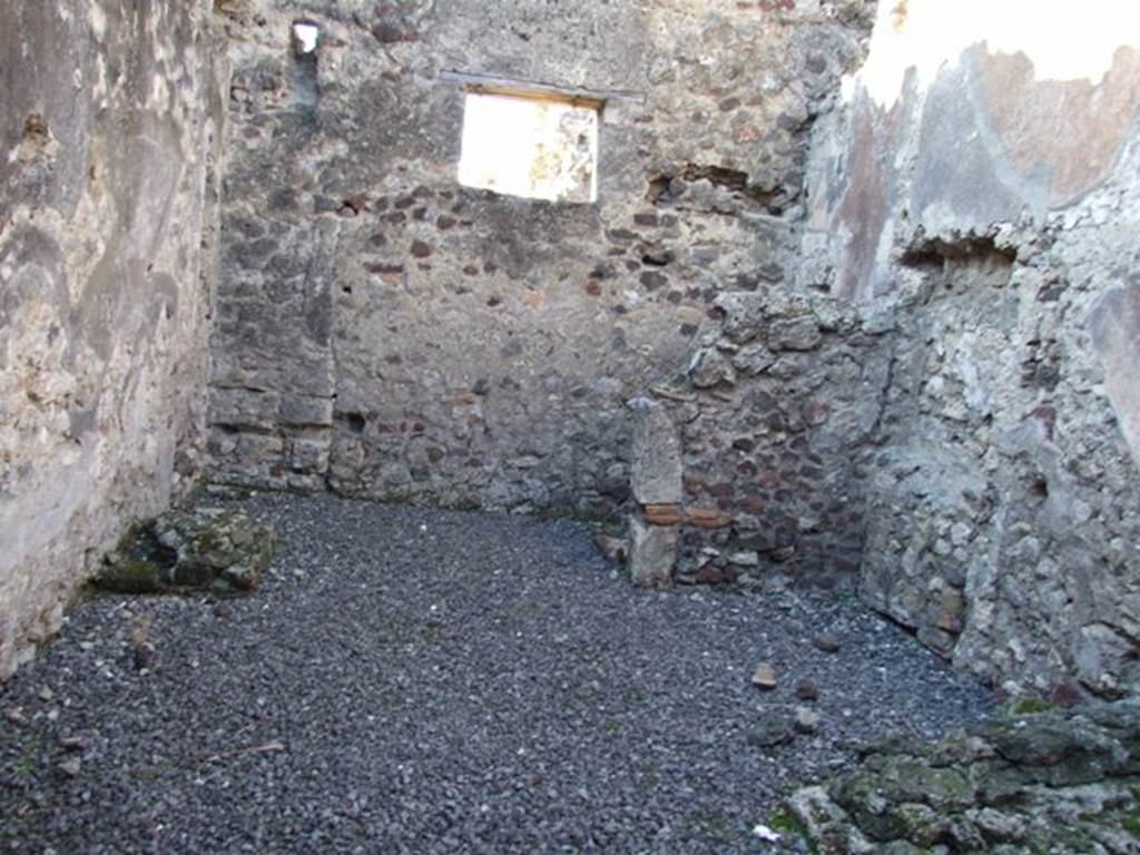 VI.11.8 Pompeii. December 2007. Room 56, looking west.  
Against the north wall, on right, would have been the stairs to the upper floor, and in the north-west corner under the stairs is the latrine. On the left, against the south wall was probably a hearth or a bench. 

