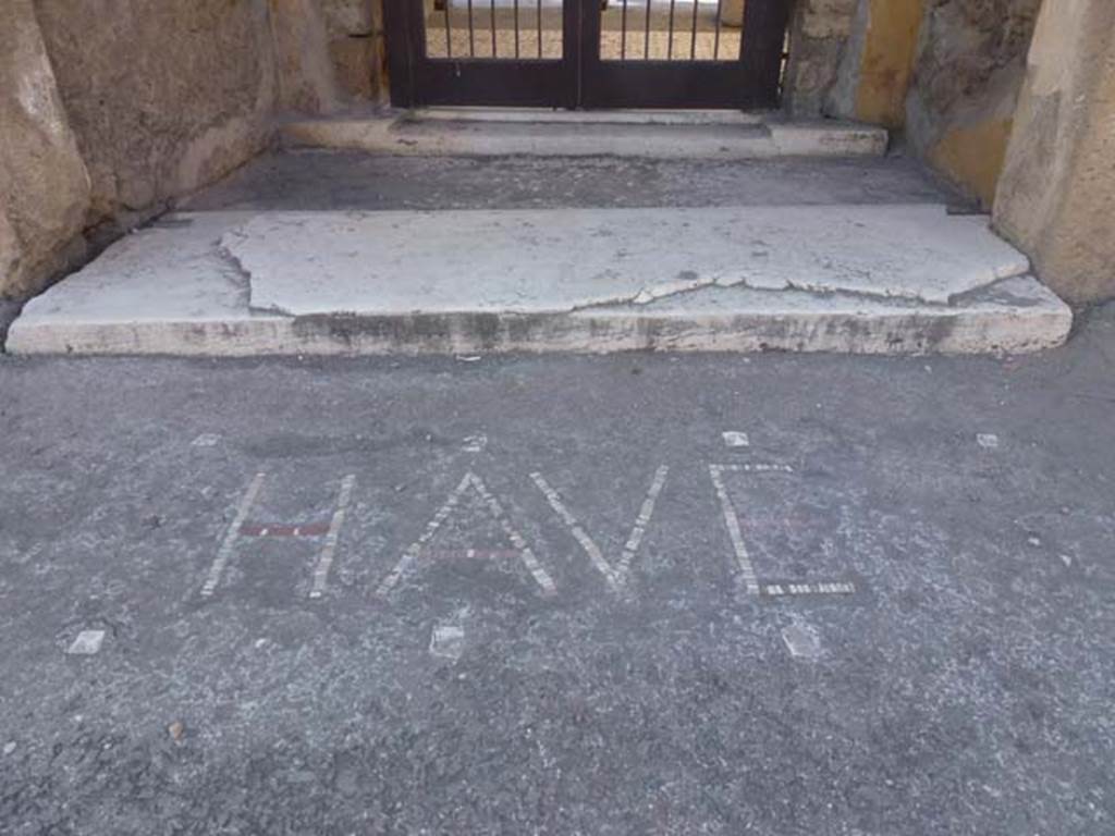 VI.12.2 Pompeii. April 2019. Wording of HAVE (Welcome) written in the pavement outside the doorway.
Photo courtesy of Rick Bauer.
