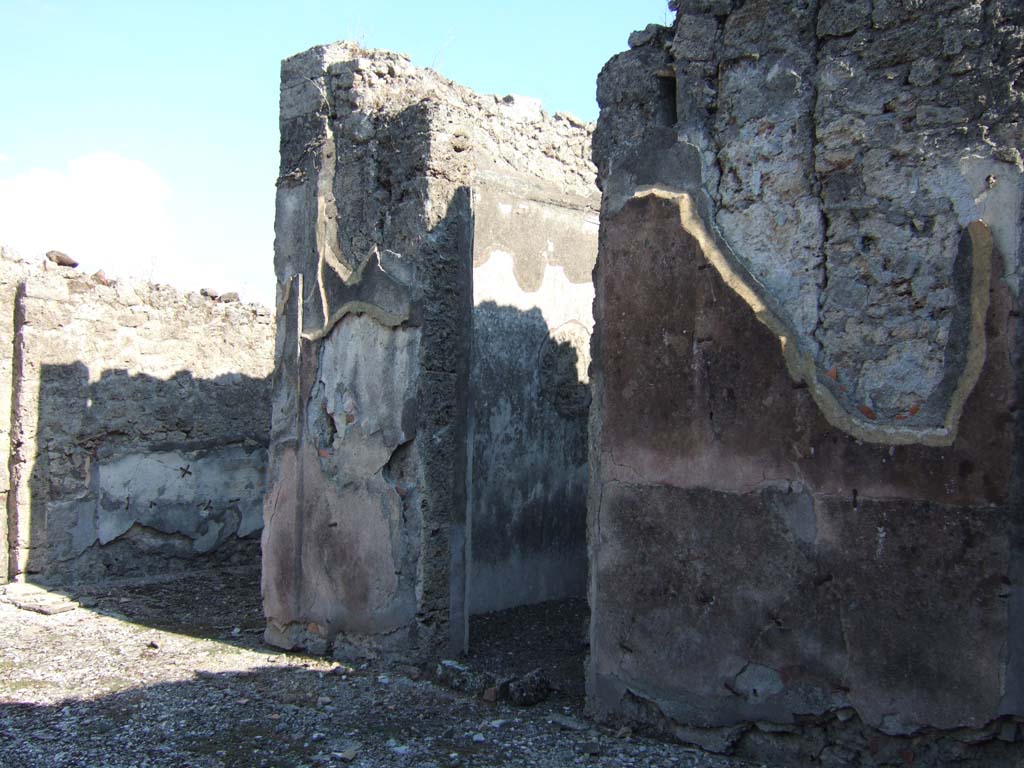 VI.13.19 Pompeii. September 2005. Looking south-east across atrium to rooms on south side. 
On the left is the south ala, with the doorway in the centre leading into a cubiculum.
