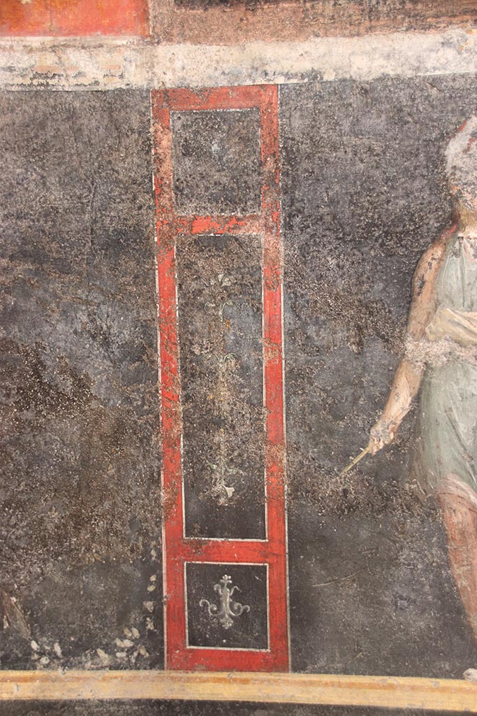 VI.15.1 Pompeii. October 2024. 
Detail from lower east wall on north side of panel with painted Amazon. Photo courtesy of Klaus Heese.
