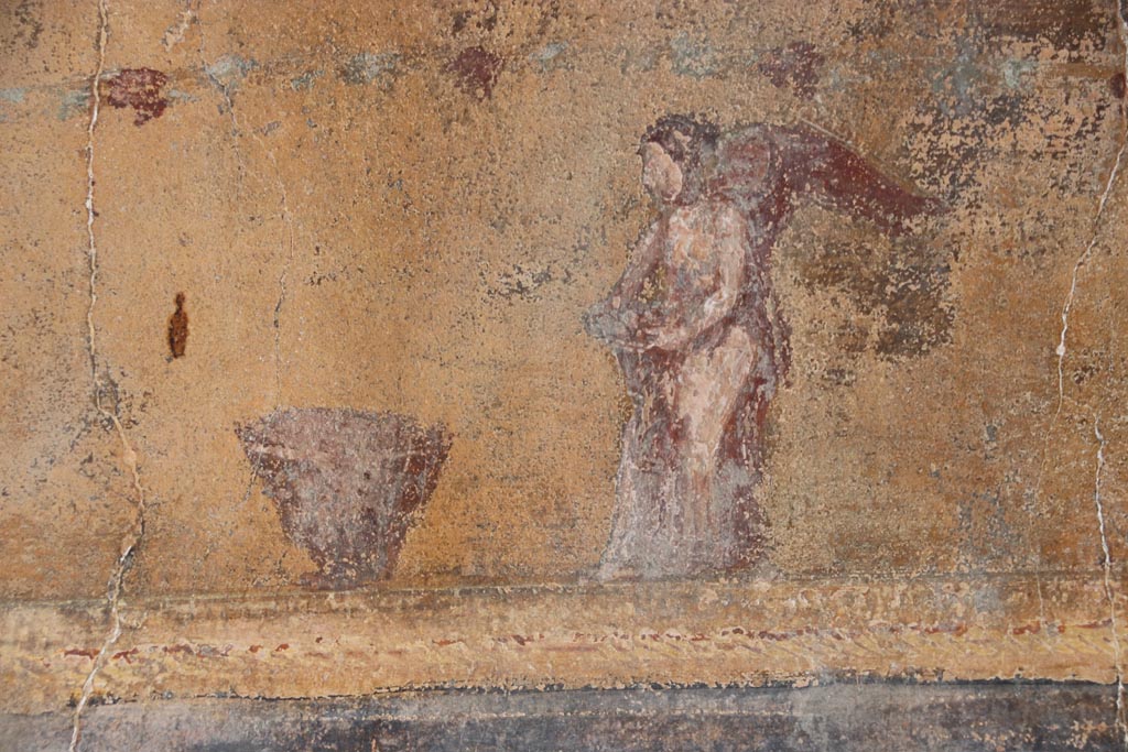 VI.15.1 Pompeii. October 2023. 
North wall of atrium, detail from lower east end of yellow panel above site of strongbox. Photo courtesy of Klaus Heese.
