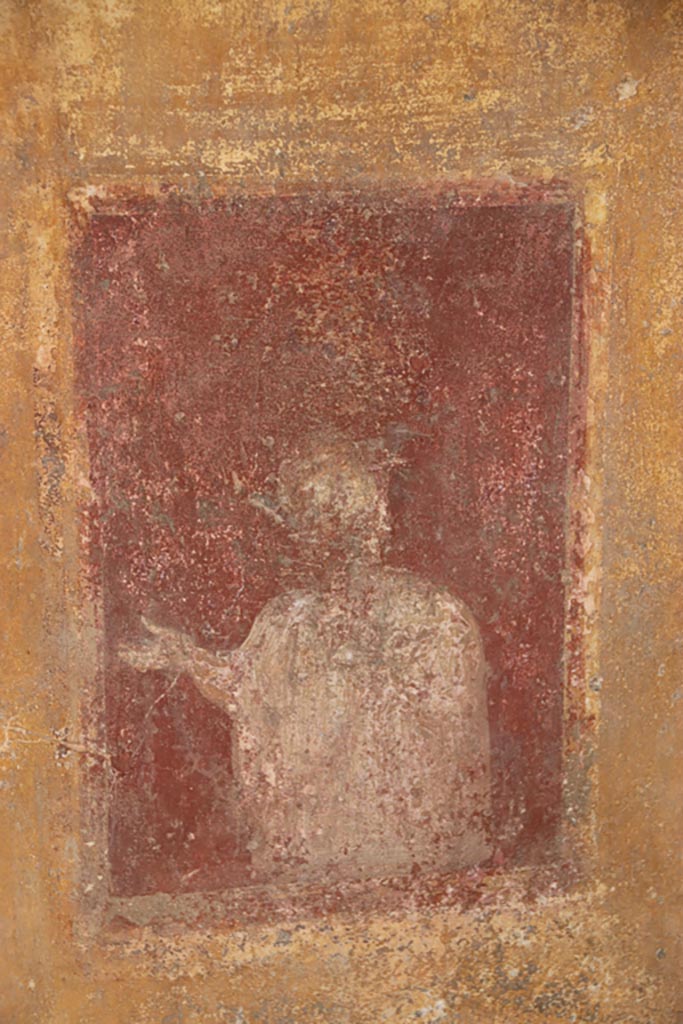 VI.15.1 Pompeii. October 2023. 
Detail from lower north wall of atrium, painted decoration from west side of masonry base for strongbox.
Photo courtesy of Klaus Heese.
