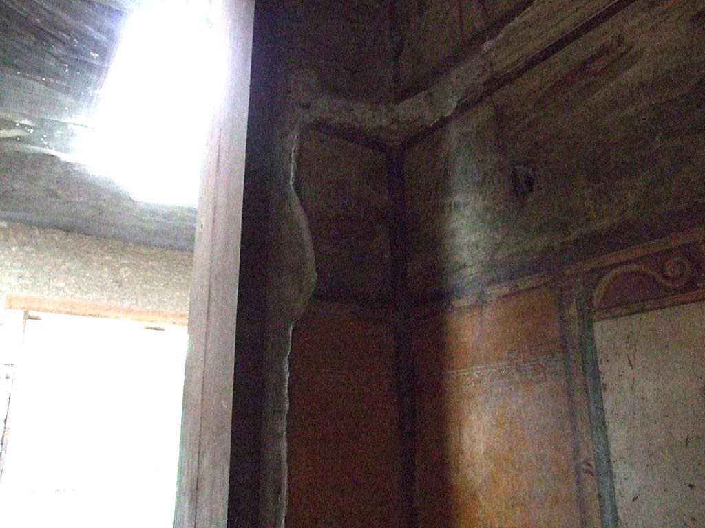 VI.15.1 Pompeii. December 2006. North-west corner with detail of painting in bedroom on left of main entrance.