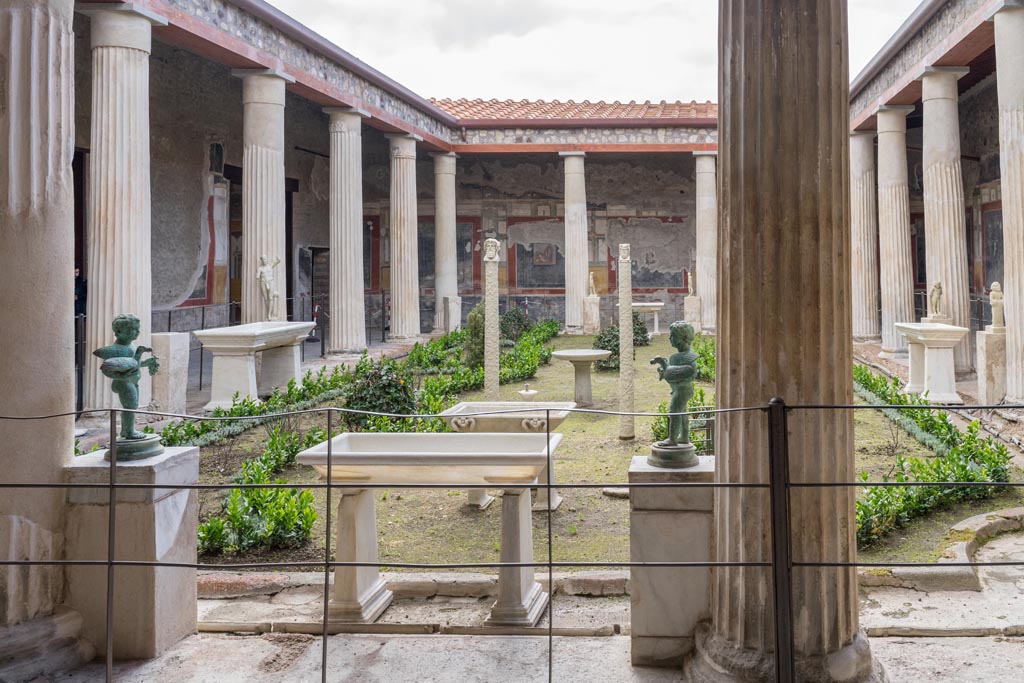 VI.15.1 Pompeii. March 2023. 
Looking south across peristyle garden from north portico outside of the “Cupid’s room”. Photo courtesy of Johannes Eber.
