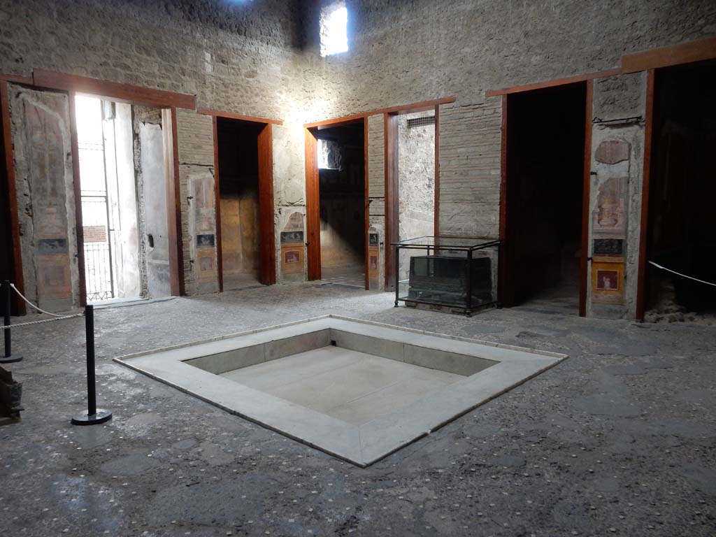 VI.15.1 Pompeii. June 2019. 
Looking south-east across atrium, with vestibule/entrance doorway, on left. Photo courtesy of Buzz Ferebee.

