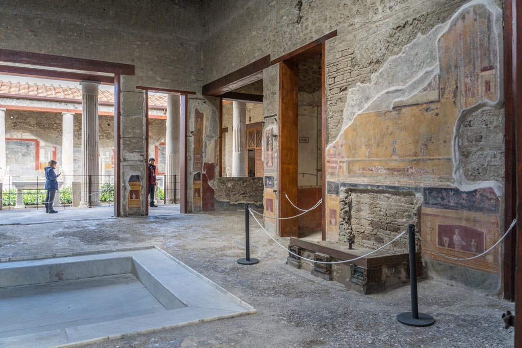 VI.15.1 Pompeii. March 2023. 
Looking north-west across impluvium in atrium from east end near entrance doorway. Photo courtesy of Johannes Eber.
