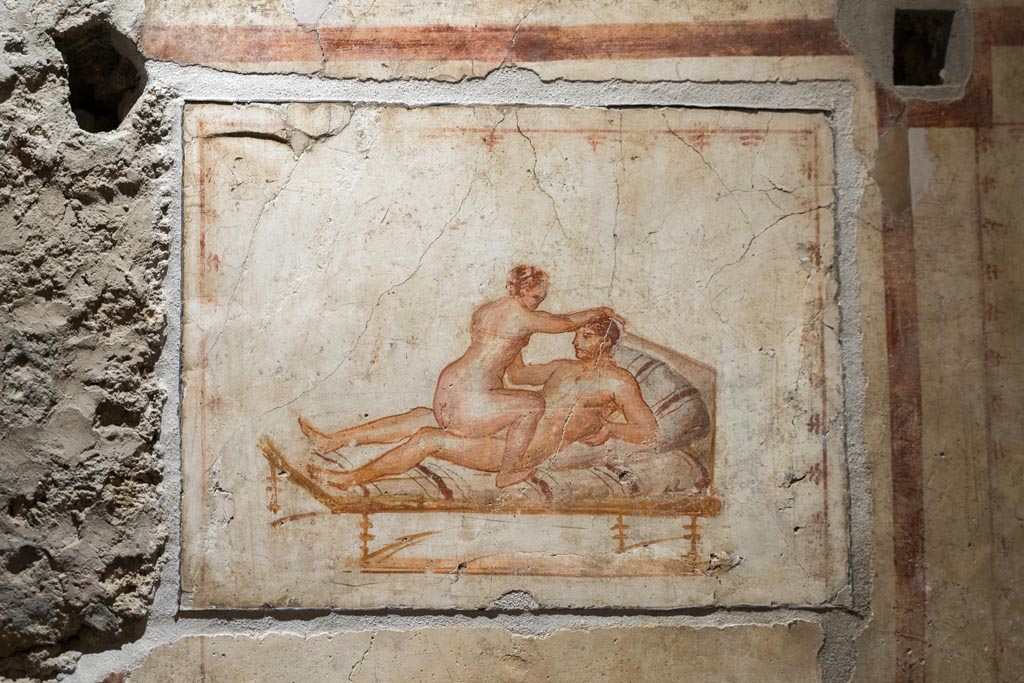 VI.15.1 Pompeii. March 2023. 
Erotic painting in bedroom, used either by servants or perhaps as a private brothel? Photo courtesy of Johannes Eber.
