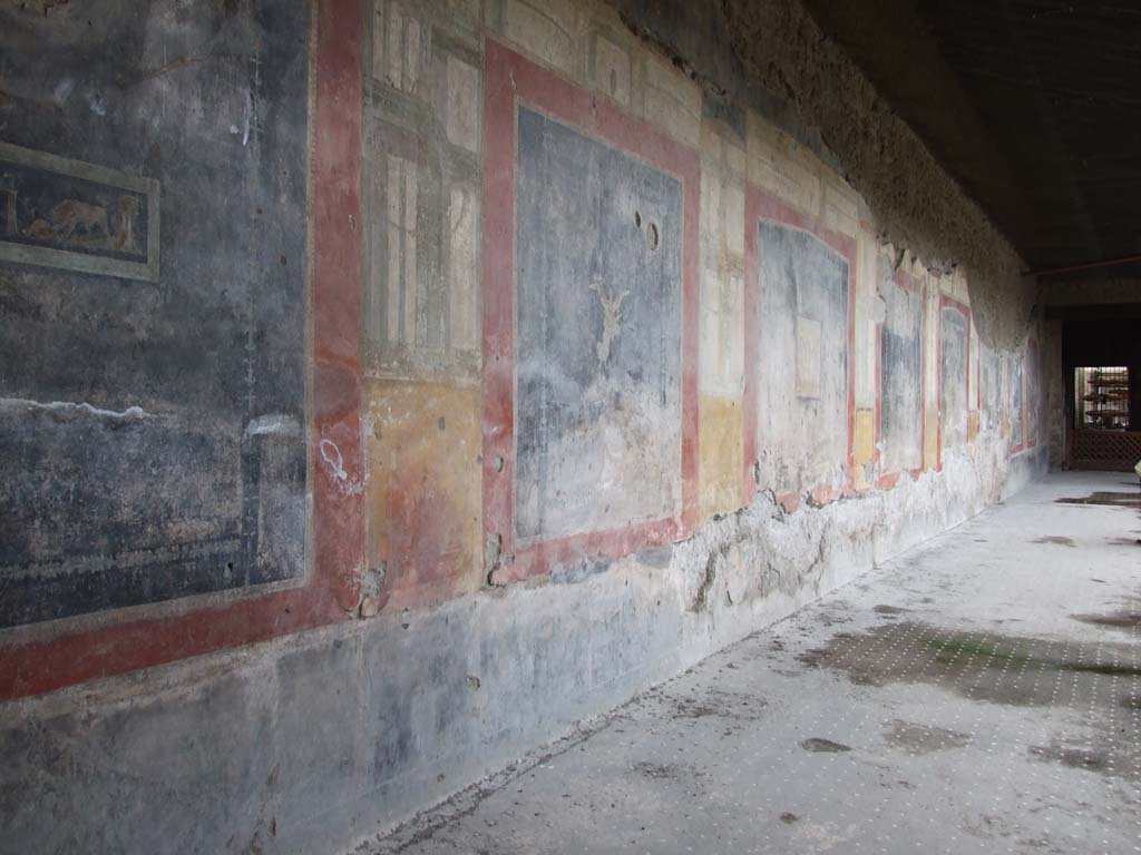 VI.15.1 Pompeii. December 2006. Looking north along west wall of west portico of peristyle.