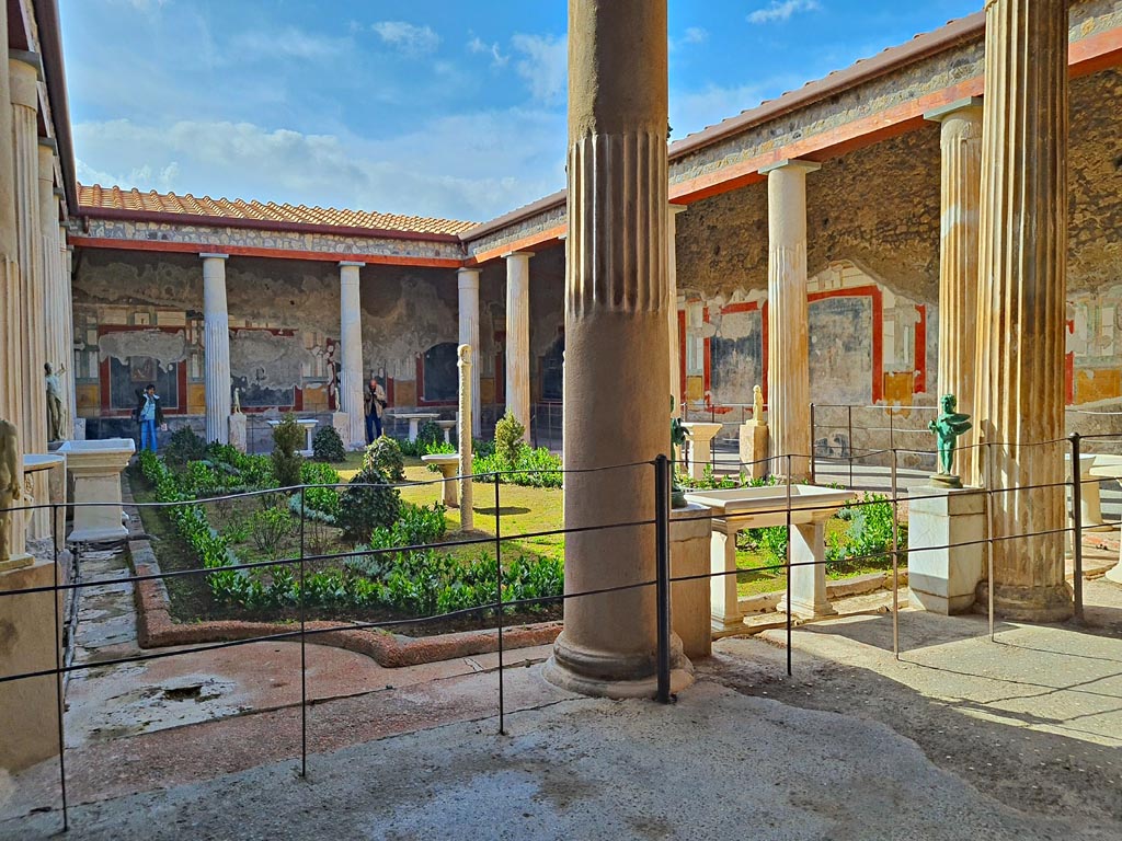 VI.15.1 Pompeii. April 2023. 
Looking south-west across peristyle garden from east end of north portico. Photo courtesy of Giuseppe Ciaramella.
